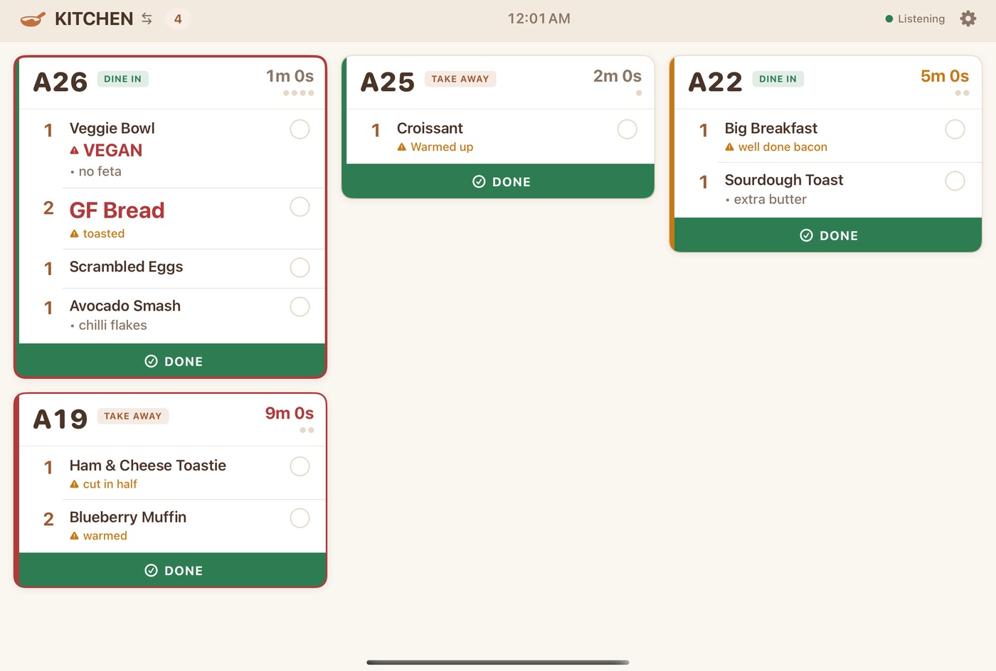 The kitchen display showing order tickets with items, modifiers and preparation times.